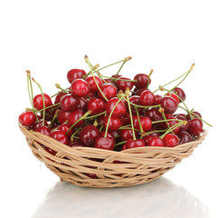 Ripe cherry berries in basket isolated on white