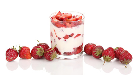 Glass of ripe strawberries with cream isolated on white