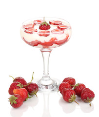 Glass of ripe strawberries with cream isolated on white