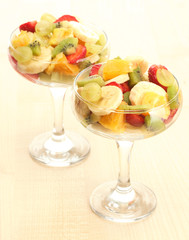 Fresh fruits salad on wooden table