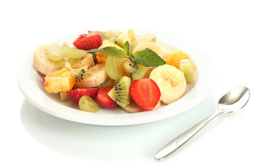 Fresh fruits salad on plate isolated on white