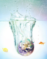 globe sinking in water