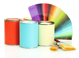 tin cans with paint, brushes and bright palette of colors