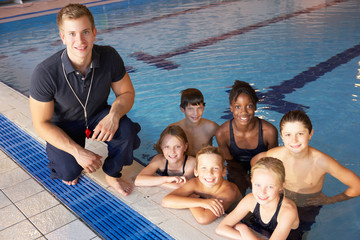 Children having swimming lesson