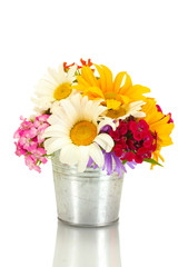 beautiful bouquet of bright wildflowers in bucket, isolated