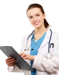 Smiling young doctor in white coat standing