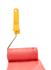 Obraz premium Paint roller with red paint isolated on white