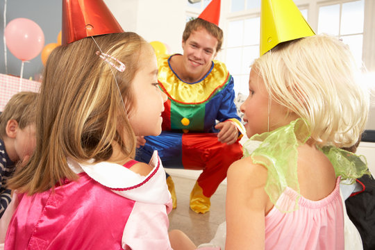 Clown entertaining children at party