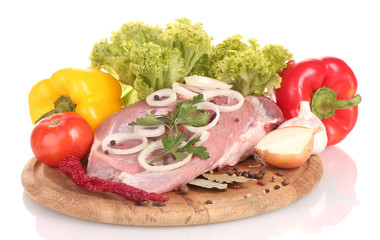 Raw meat and vegetables on a wooden board isolated on whitе