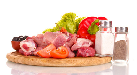 Pieces of raw meat and vegetables