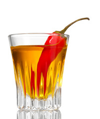 bottle and glass of pepper vodka and red chili pepper isolated