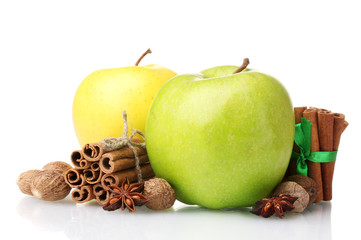 Cinnamon sticks, apples, nutmeg and anise isolated on white