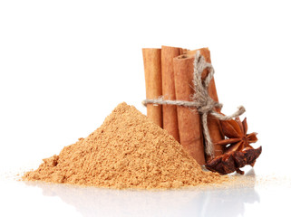Cinnamon sticks, powder and anise isolated on white