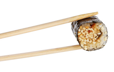 Holding roll with chopsticks isolated on white