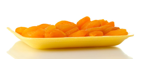 delicious dried apricots in packaging isolated on white