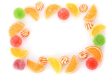 frame of colorful jelly candies isolated on white