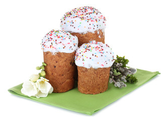 Beautiful Easter cakes, colorful eggs in basket and flowers