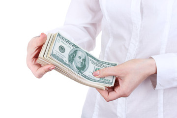 American dollars in a women hands on a white background.