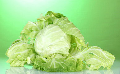 Cabbage on bright green background