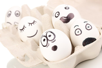 White eggs with funny faces
