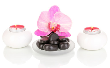 Obraz na płótnie Canvas Spa stones with orchid flower and candles isolated on white