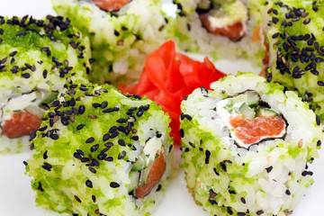 Tasty rolls served on white plate close-up