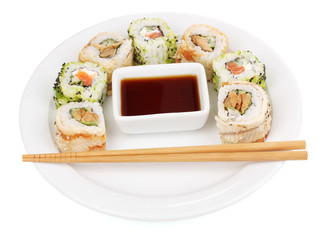 Tasty rolls served on plate with chopsticks isolated on white