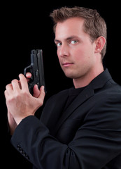 Male caucasian model with a gun