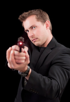 Male caucasian model with a gun