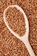 Buckwheat with a wooden spoon