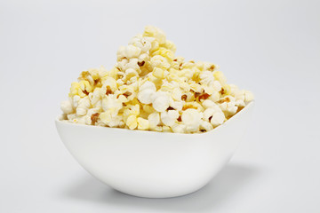 Bowl of popcorn isolated on white background