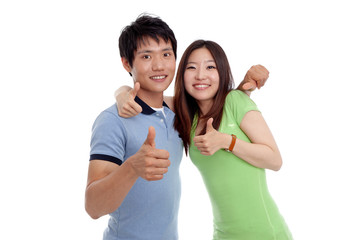 Young smiling people with thumbs up gesture on white background