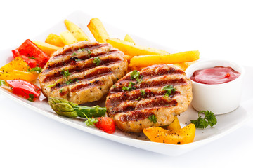 Grilled steak, French fries and vegetables