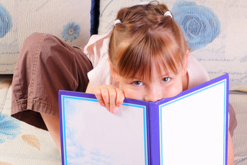 Pretty little girl with book