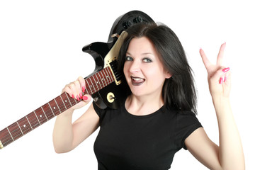 Fototapeta premium Brunette girl posing with a guitar isolated