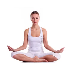 Young woman practicing yoga, sitting in a lotus position © Andrey Bandurenko