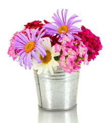 beautiful bouquet of bright wildflowers in bucket, isolated