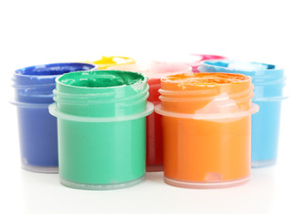 jars with multicolored gouache isolated on white background