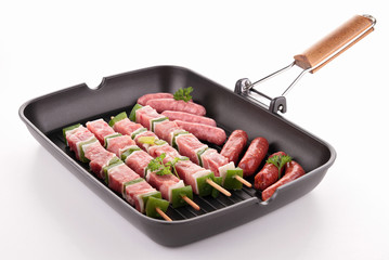 raw meats in grill pan