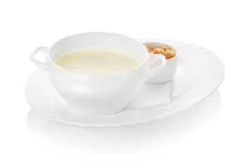 A bowl of creamy vegetable soup isolated