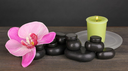 Fototapeta na wymiar Spa stones with orchid flower and candle