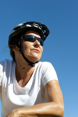 Portrait confident mature bike riding woman