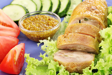 Tasty meat cutlet with garnish on plate close-up