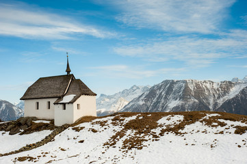 Small church with mountain panorama