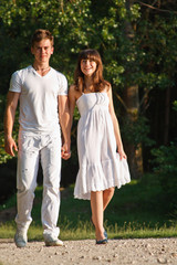 Fototapeta premium Couple walking outdoors together