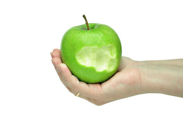 green apple on a female hand