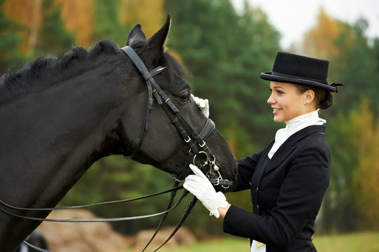 Horsewoman Jockey In Uniform With Horse