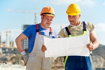 Engineers builders at construction site