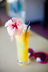 exotic tropical cocktail with hibiskus flower on top © el.rudakova