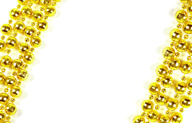 Background made of a brilliant celebratory beads of golden color